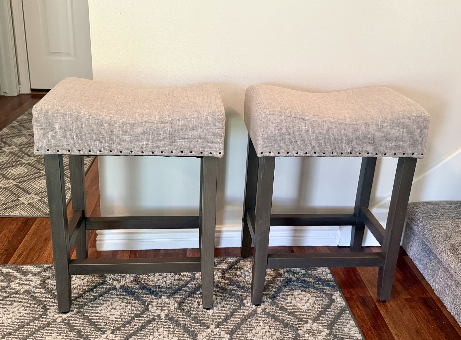 Set of 2 Light Gray Upholstered Bar Stools with Nailhead Trim & Dark Wood Legs