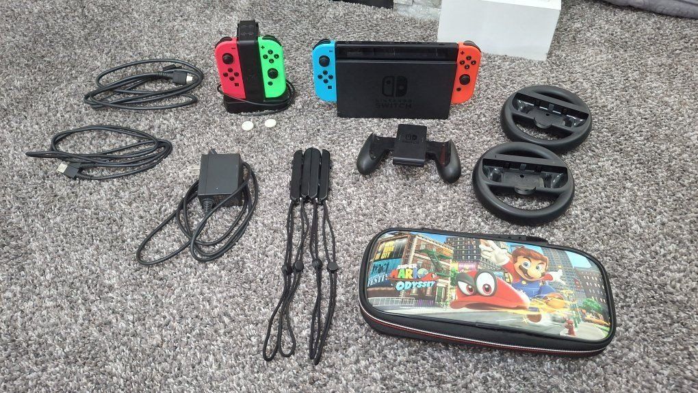 Nintendo Switch Console, Joy-Cons, Dock, Mario Odyssey Case, Steering Wheels & Accessories Bundle