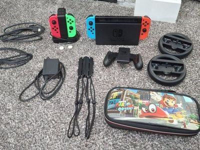 Nintendo Switch Console, Joy-Cons, Dock, Mario Odyssey Case, Steering Wheels & Accessories Bundle