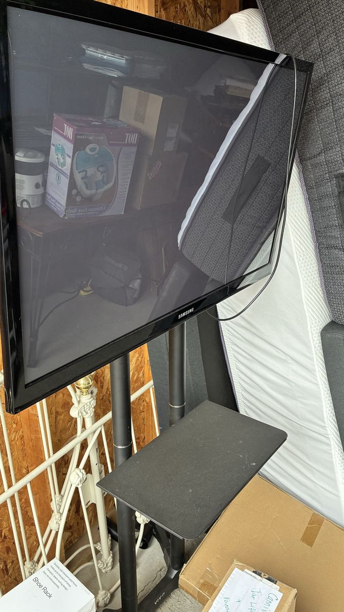 Samsung Flat Screen TV on VIVO Mobile Stand with Shelf
