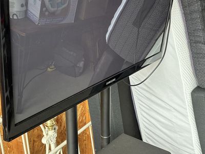 Samsung Flat Screen TV on VIVO Mobile Stand with Shelf