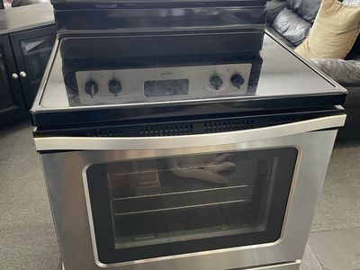 Whirlpool WFE320M0S0 electric range and GE over oven fan/light/hood.
