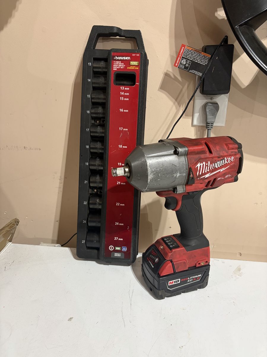 Milwaukee M18 FUEL 1/2" Impact Wrench with XC5.0 Battery and Husky 11-Piece Metric Socket Set