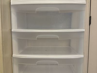 3 sets of clear, wide plastic storage drawers