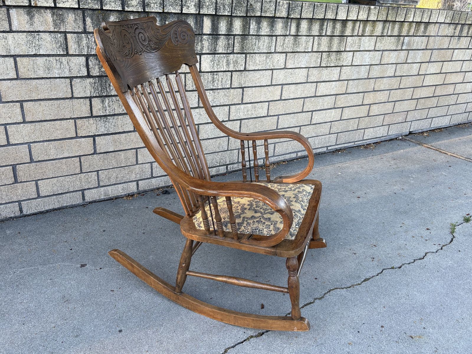 Beautiful Antique wooden rocking chair, carved back