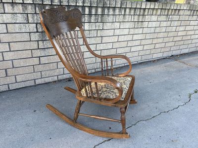 Beautiful Antique wooden rocking chair, carved back