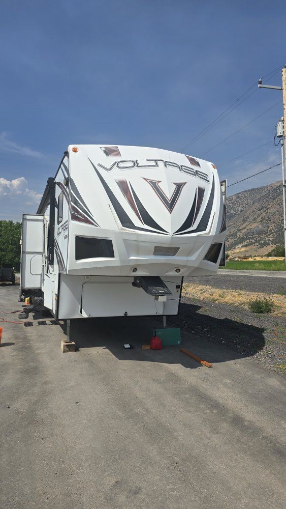 Dutchmen Voltage Fifth Wheel Toy Hauler Trailer with Rear Patio and Slide Outs
