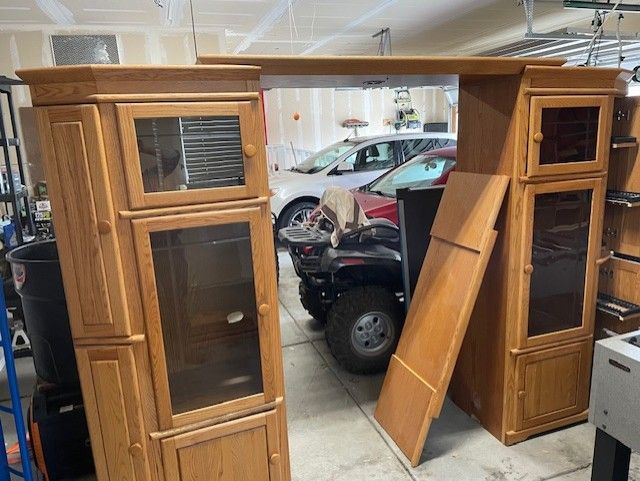$140 obo. Oak entertainment center with roll out storage and lighting