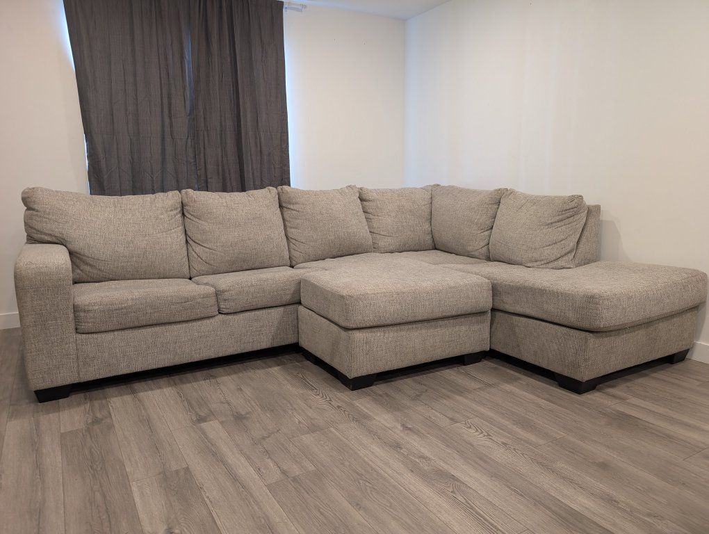 Large Beige Sectional Sofa with Reversible Chaise