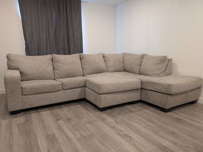 Large Beige Sectional Sofa with Reversible Chaise