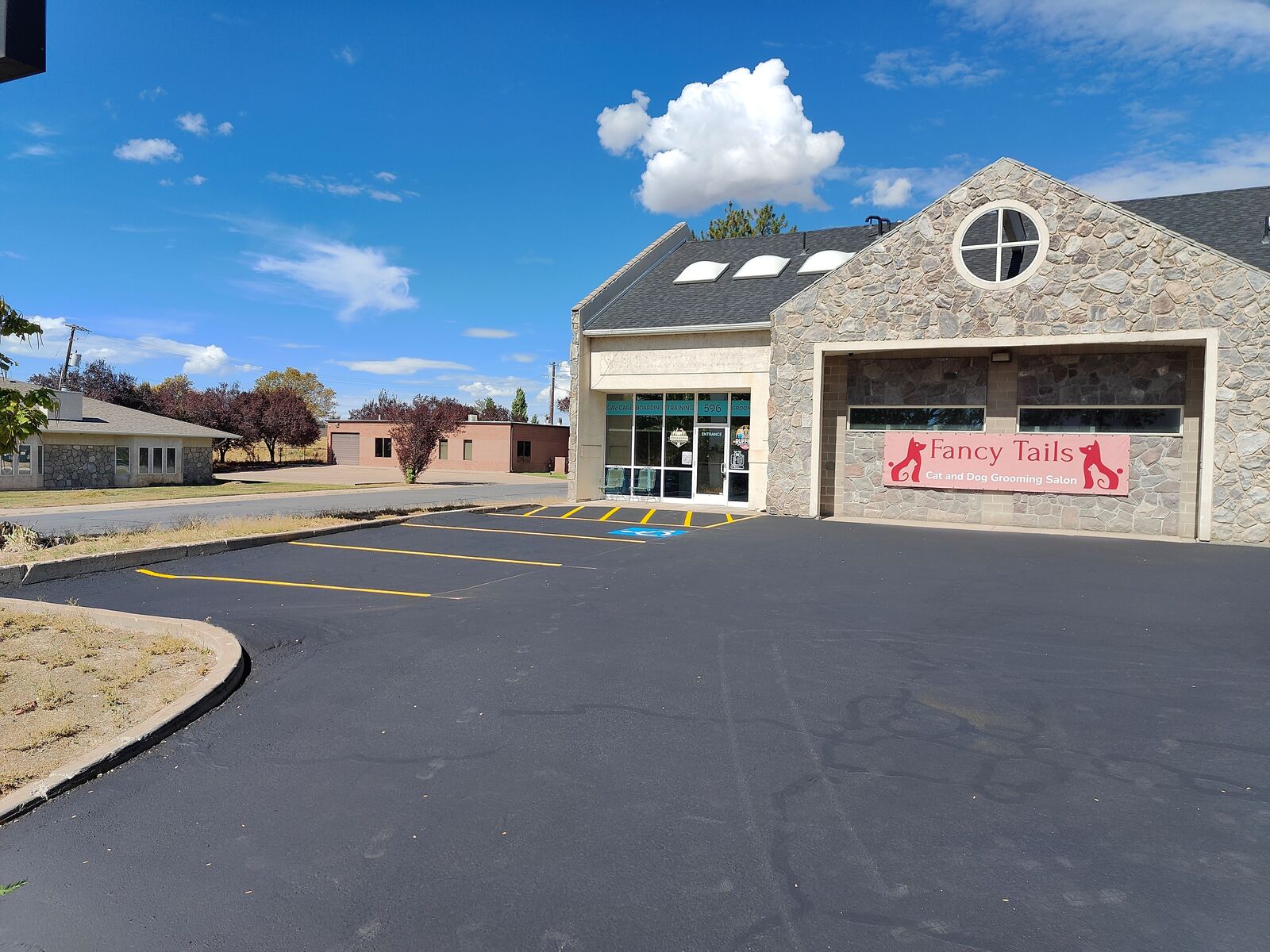 Asphalt Sealcoating - Crack Filling - Striping - Patching