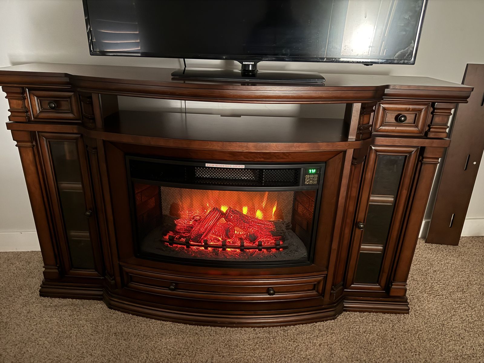Dark wood electric fireplace entertainment center
