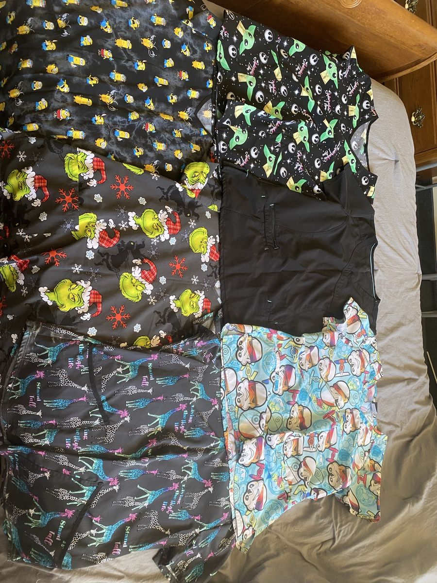 7 Scrubs tops and 1 full scrub outfit