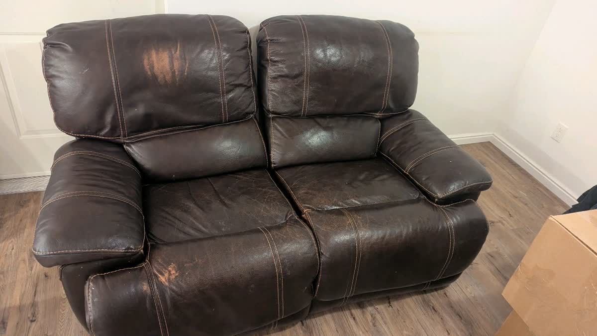 Leather reclining love seat