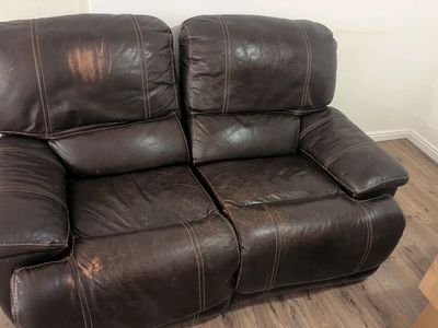 Leather reclining love seat
