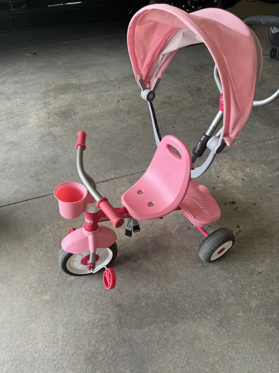 Radio Flyer 4-in-1 Stroll 'N Trike Pink Kids Tricycle with Canopy and Push Handle