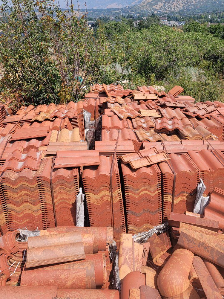 S tile roofing and outside paver rock pallets