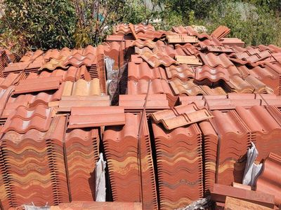 S tile roofing and outside paver rock pallets