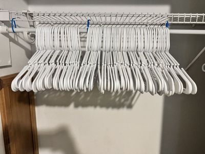 300 plastic clothes hangers (variety - black, white, grey)