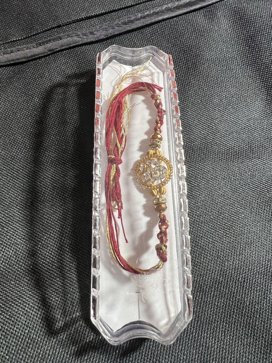 Traditional Indian Rakhi Bracelet with Om Symbol & Crystals - Red & Gold Thread