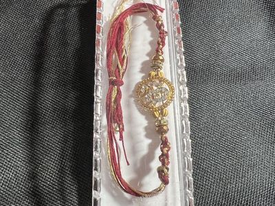 Traditional Indian Rakhi Bracelet with Om Symbol & Crystals - Red & Gold Thread