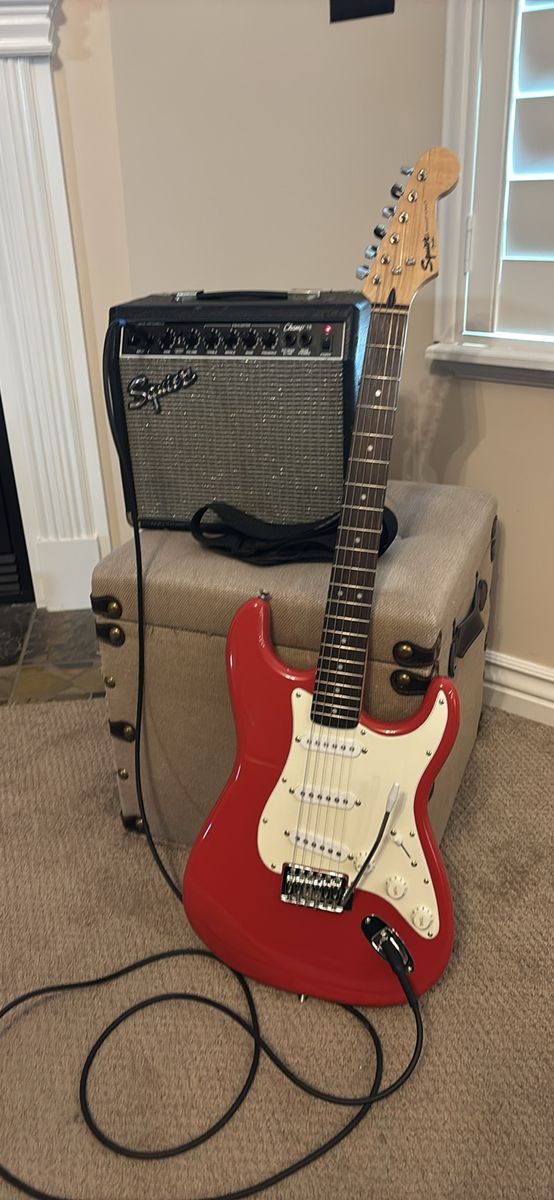 Squier by Fender Bullet Strat Electric Guitar with Squier Champ 15 Amplifier and Cable