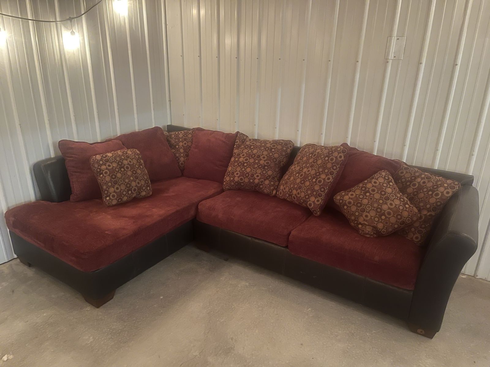 L-Shaped Sectional Sofa - Red Fabric & Brown Faux Leather with Patterned Accent Pillows