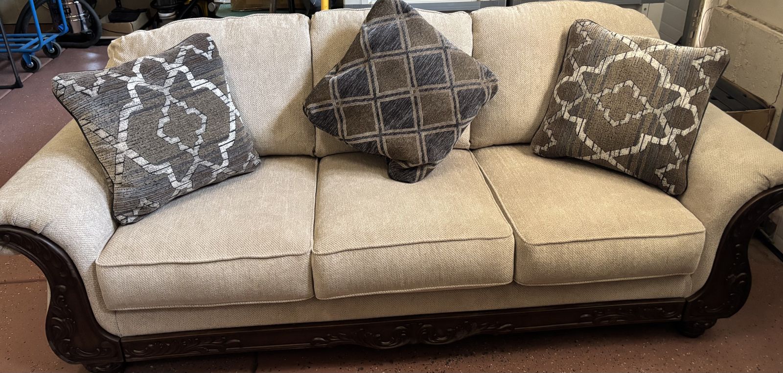 Elegant Beige Fabric Sofa with Ornate Dark Wood Trim - 3-Seater Couch