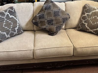Elegant Beige Fabric Sofa with Ornate Dark Wood Trim - 3-Seater Couch