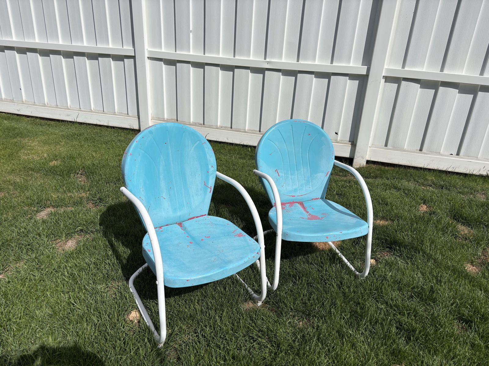 Pair of vintage metal patio chairs
