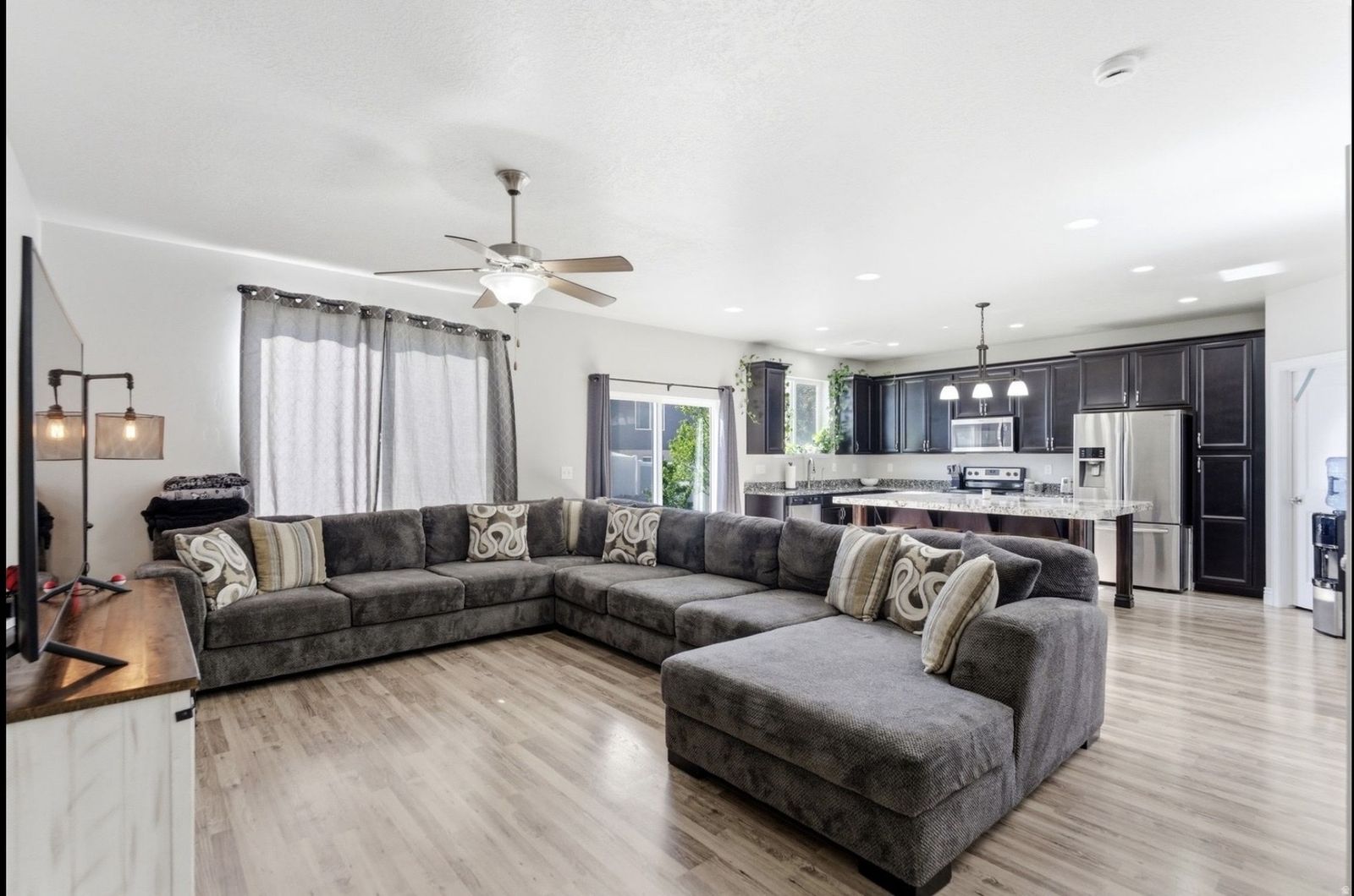 Large Gray Sectional Sofa with Right-Hand Facing Chaise and Throw Pillows