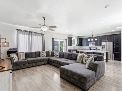 Large Gray Sectional Sofa with Right-Hand Facing Chaise and Throw Pillows