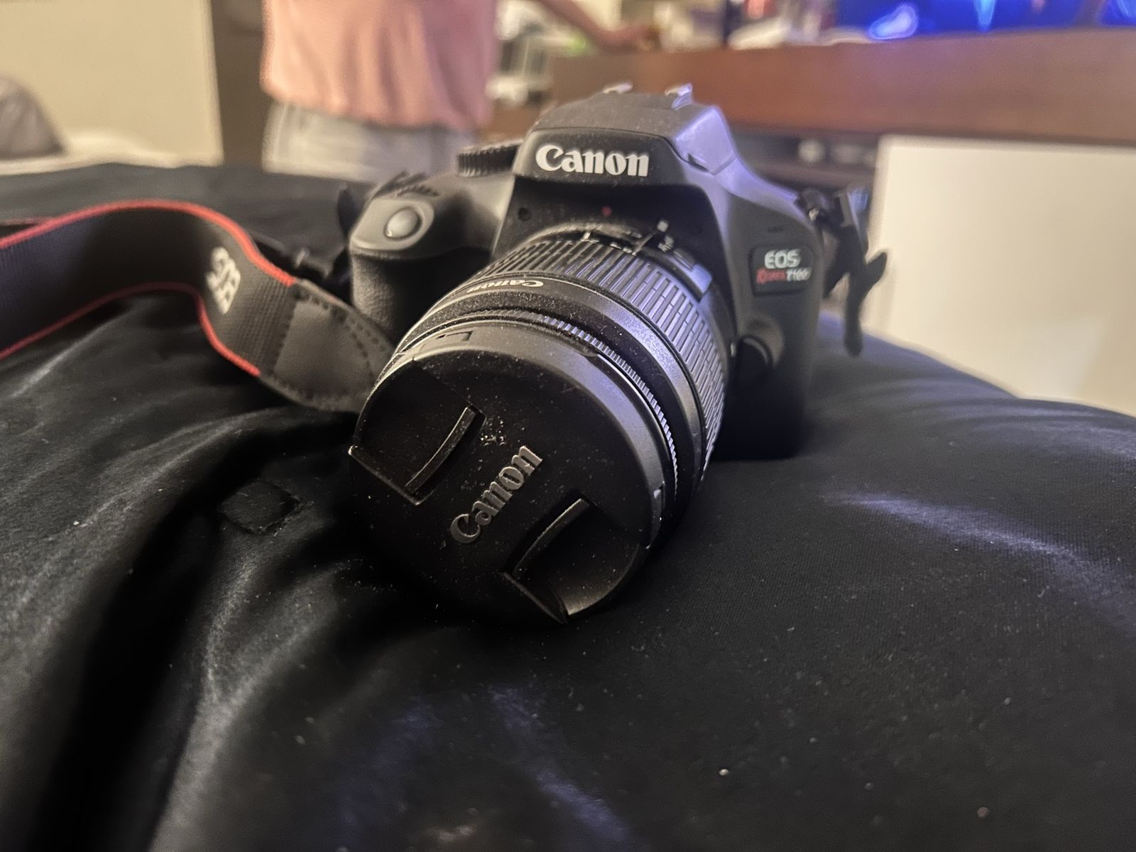 Canon EOS Rebel T100 DSLR Camera with Lens and Strap