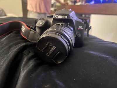 Canon EOS Rebel T100 DSLR Camera with Lens and Strap