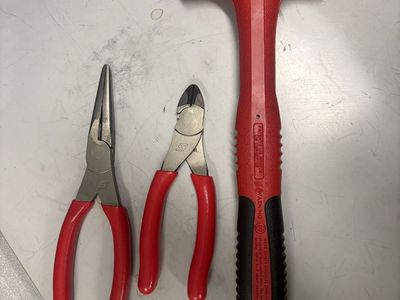 Snap on. Pliers, wire cutters and mallet