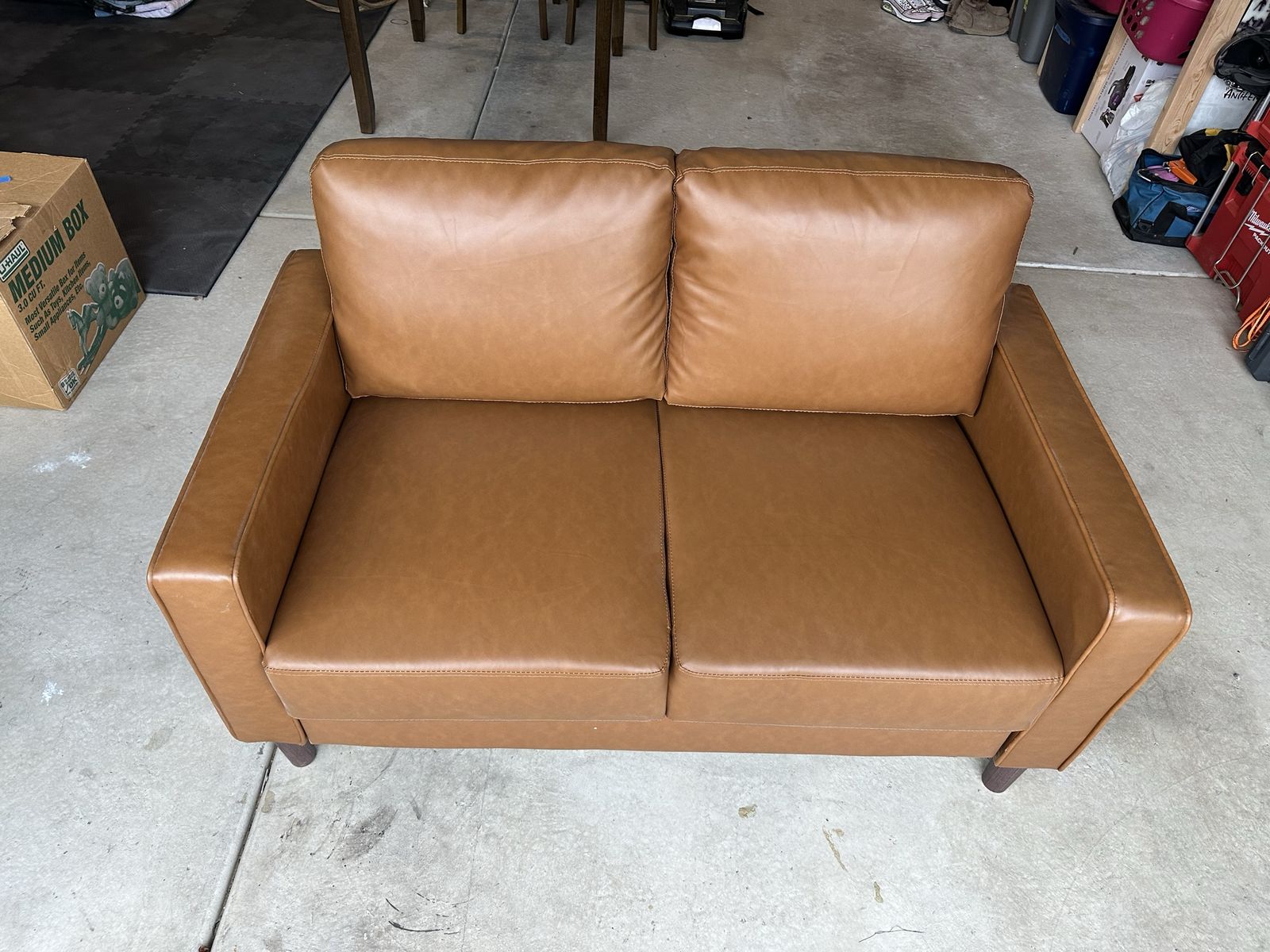 Brown faux leather loveseat