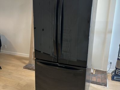 Black StainlessLG Refrigerator in working condition