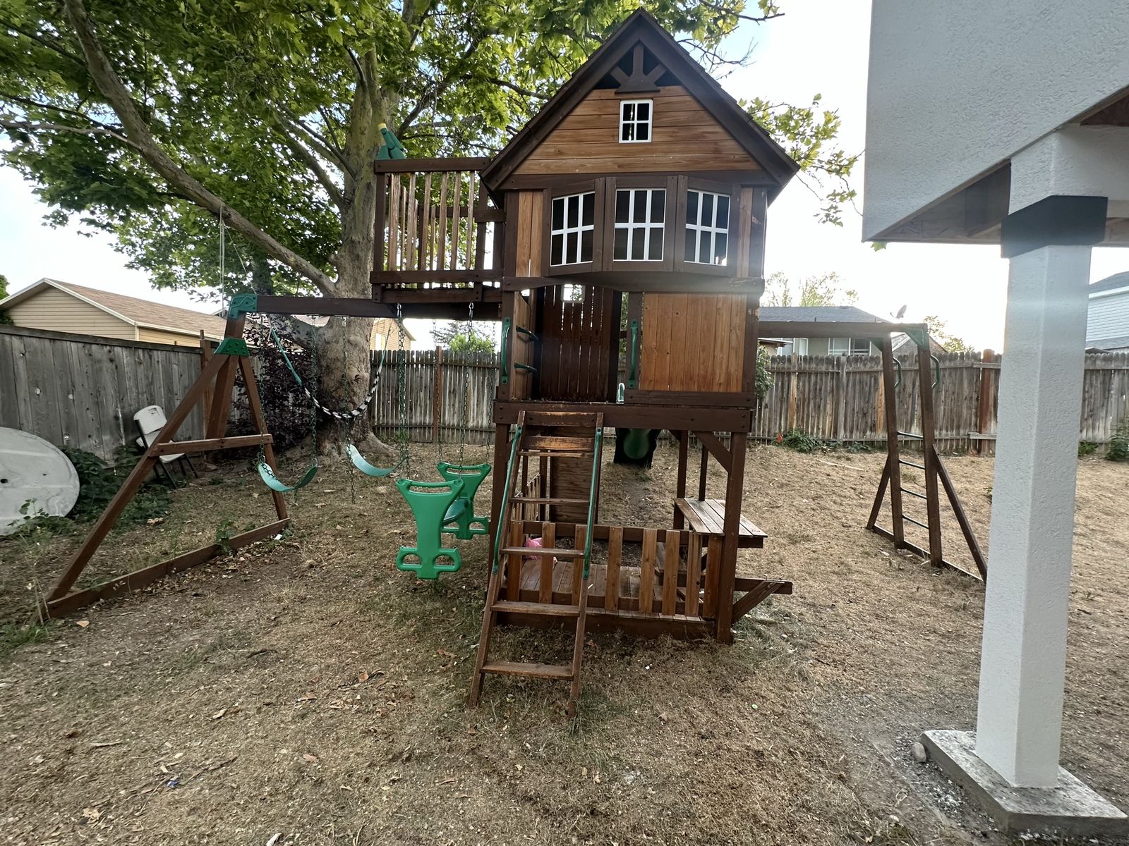 Large Wooden Outdoor Playhouse & Swing Set - Backyard Fun for Kids