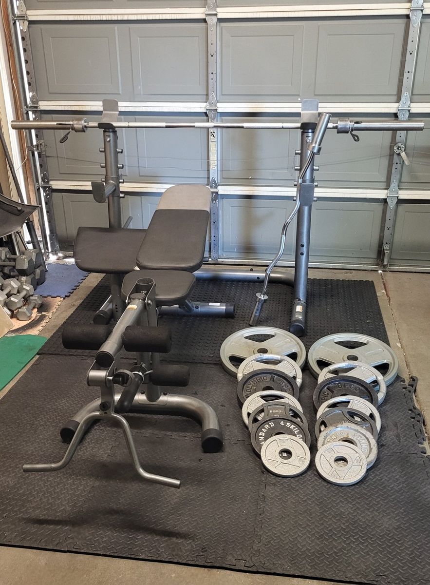 Bench and 260 pounds of weights
