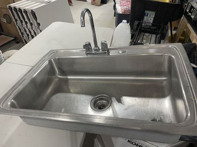 Stainless steel sink with faucet
