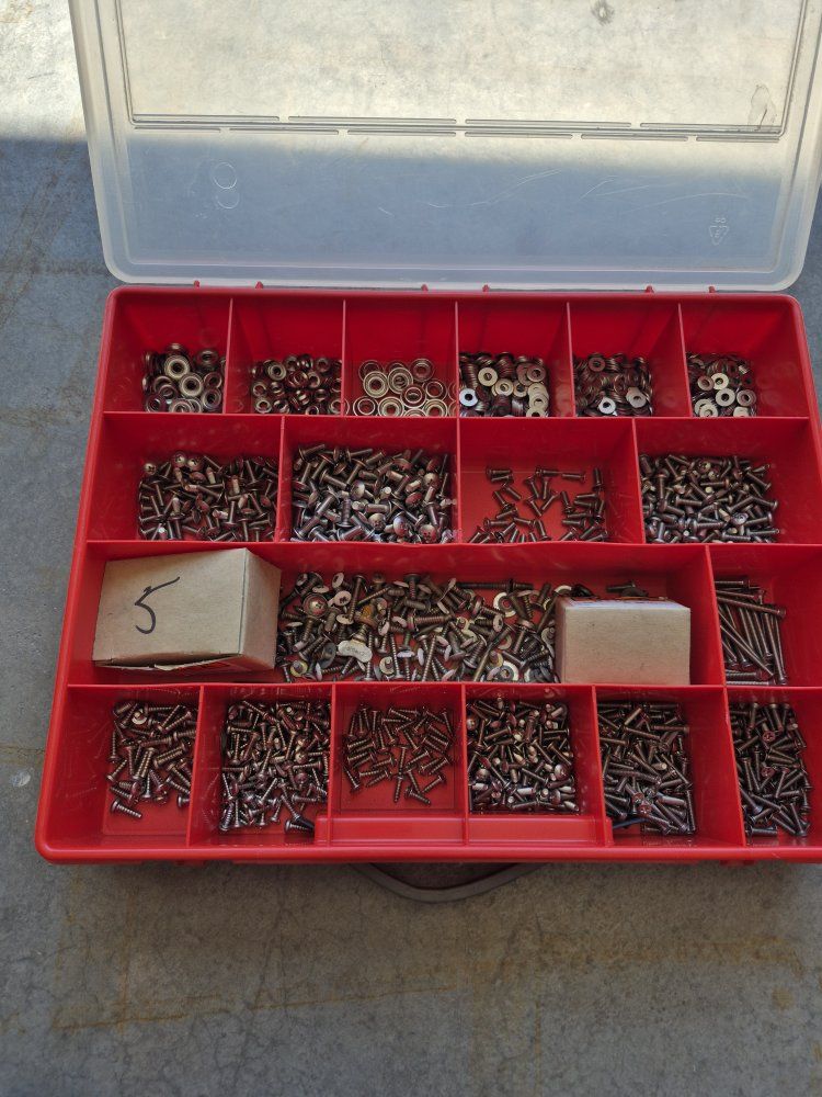 Assorted Stainless Steel Screws, Washers and Fasteners in Red Storage Organizer Box.  Used on Aircraft Inspection Covers. 