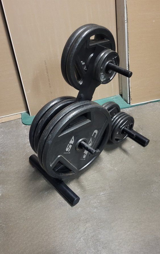 255 pounds of Olympic weights
