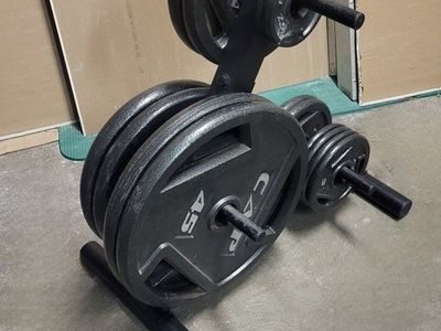 255 pounds of Olympic weights