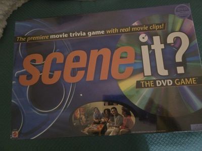 Scene It? The DVD Game - Premiere Movie Trivia Game with Real Movie Clips, Ages 13+
