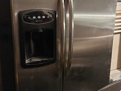 Maytag Side-by-Side Stainless Steel Refrigerator and Freezer with Water Dispenser