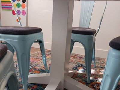 White table and 4 Aqua colored chairs