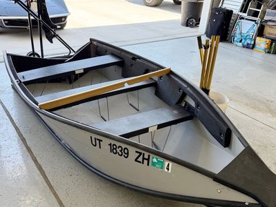 Porta Bote - 12' folding boat with motor.