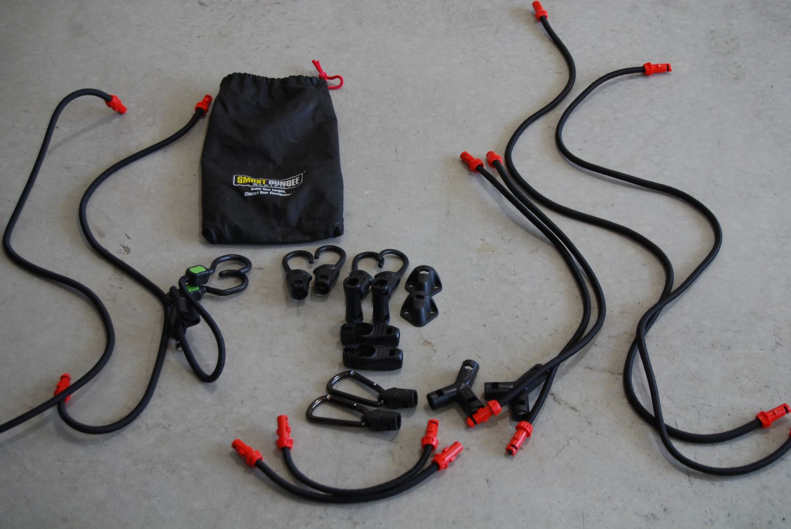 Smart bungee system includes cords and fasteners to create the cords you need