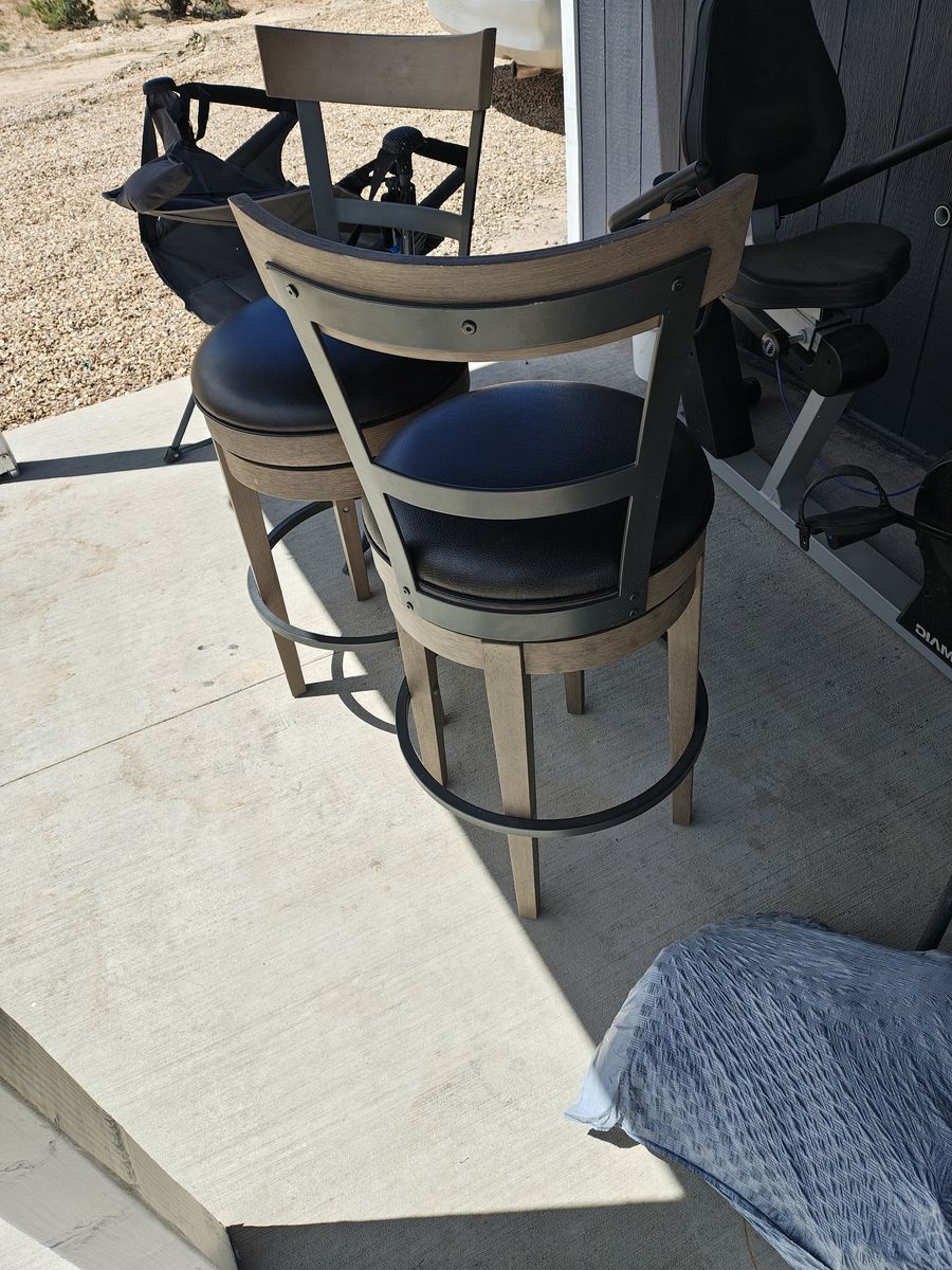 2 like new tall swivel bar stool
