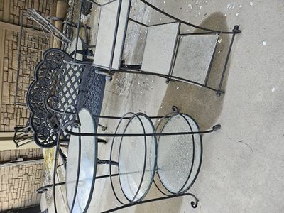 Two iron and glass outdoor tables